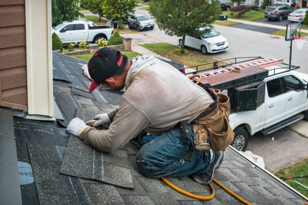 Professional Roofing technician working in Lansing, NY